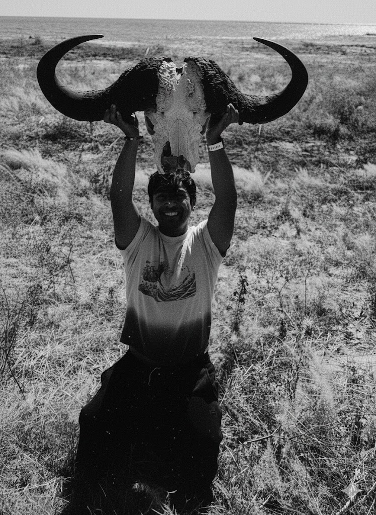 Outdoor portrait with animal skull in grassland
